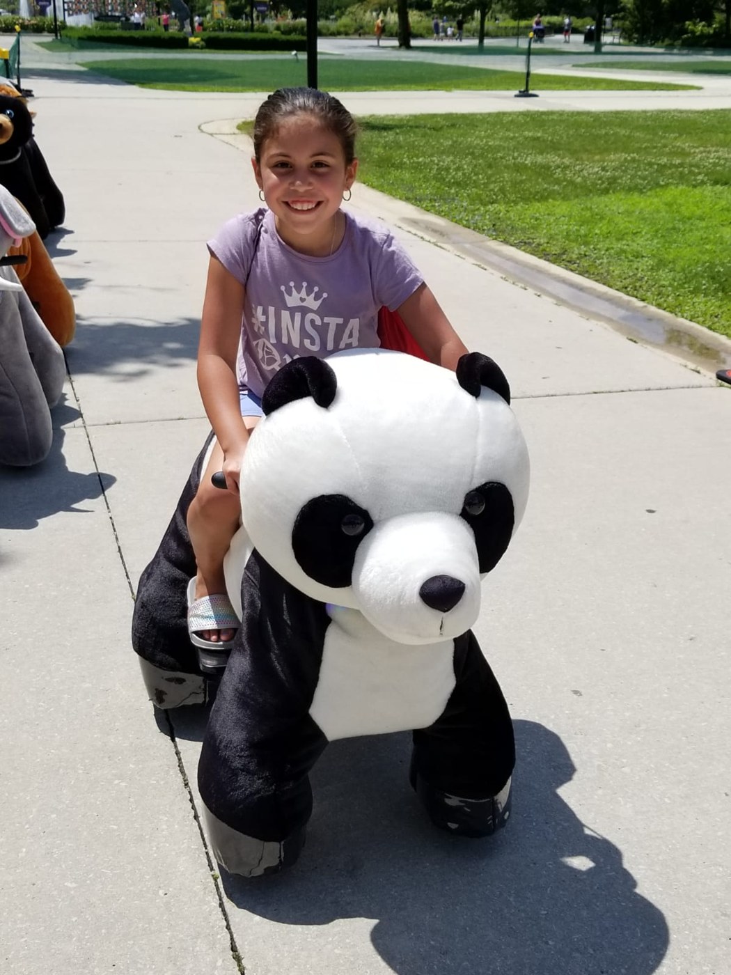 Guest riding a plush panda